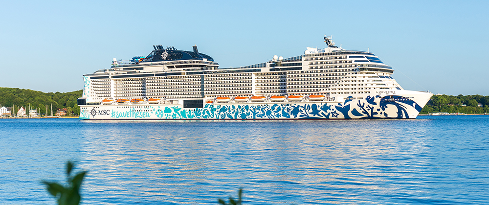 Coco Cay, Bahamas -2023: Symphony of the Seas cruise ship. Operated by Royal Caribbean cruise line. Docked at Royal Caribbean's private island. Oasis Class ship, one of the largest in the fleet.