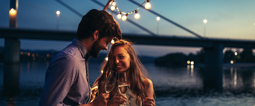 Cropped shot of an attractive young couple drinking champagne a on a boat