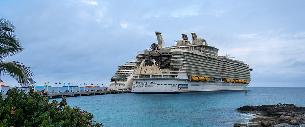 Coco,Cay,,Bahamas,-2023:,Symphony,Of,The,Seas,Cruise,Ship. Coco Cay, Bahamas -2023: Symphony of the Seas cruise ship. Operated by Royal Caribbean cruise line. Docked at Royal Caribbean's private island. Oasis Class ship, one of the largest in the fleet.